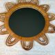 Rattan mirror representing a sun