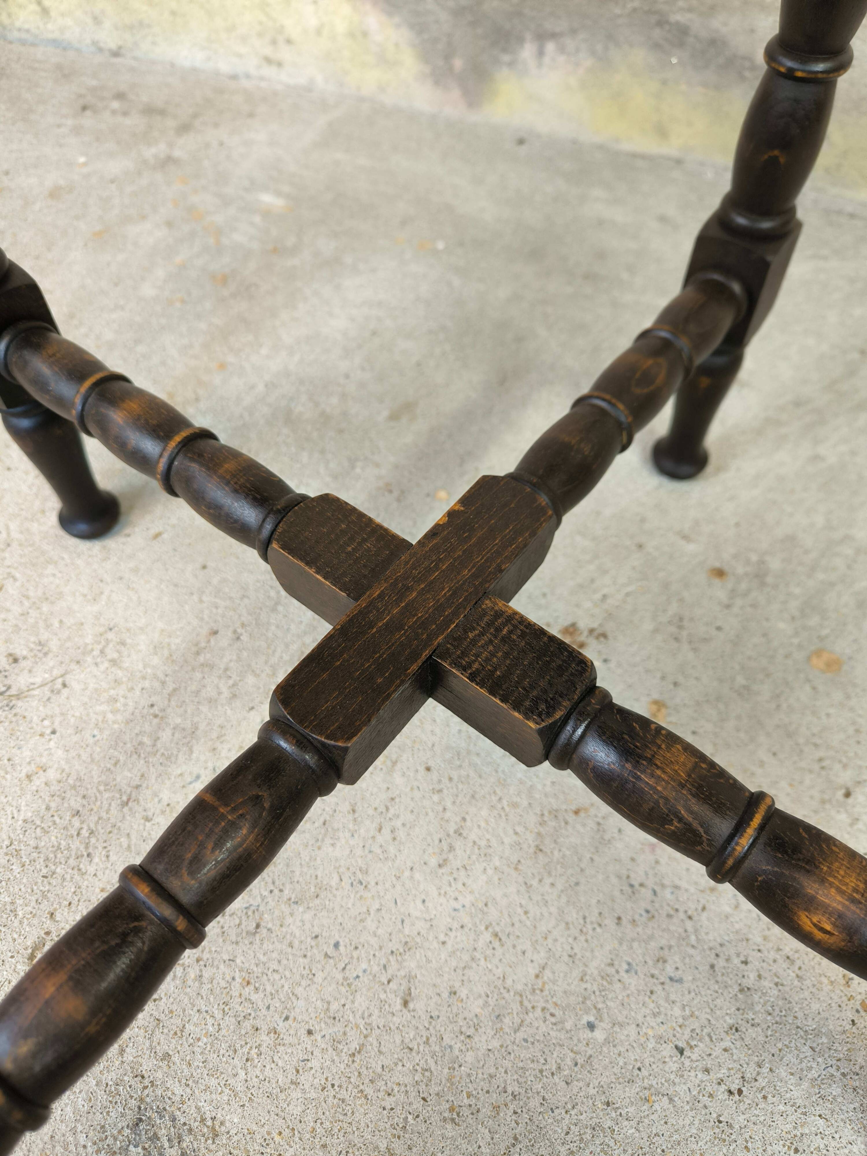 Vintage gueridon with beaded wooden legs.