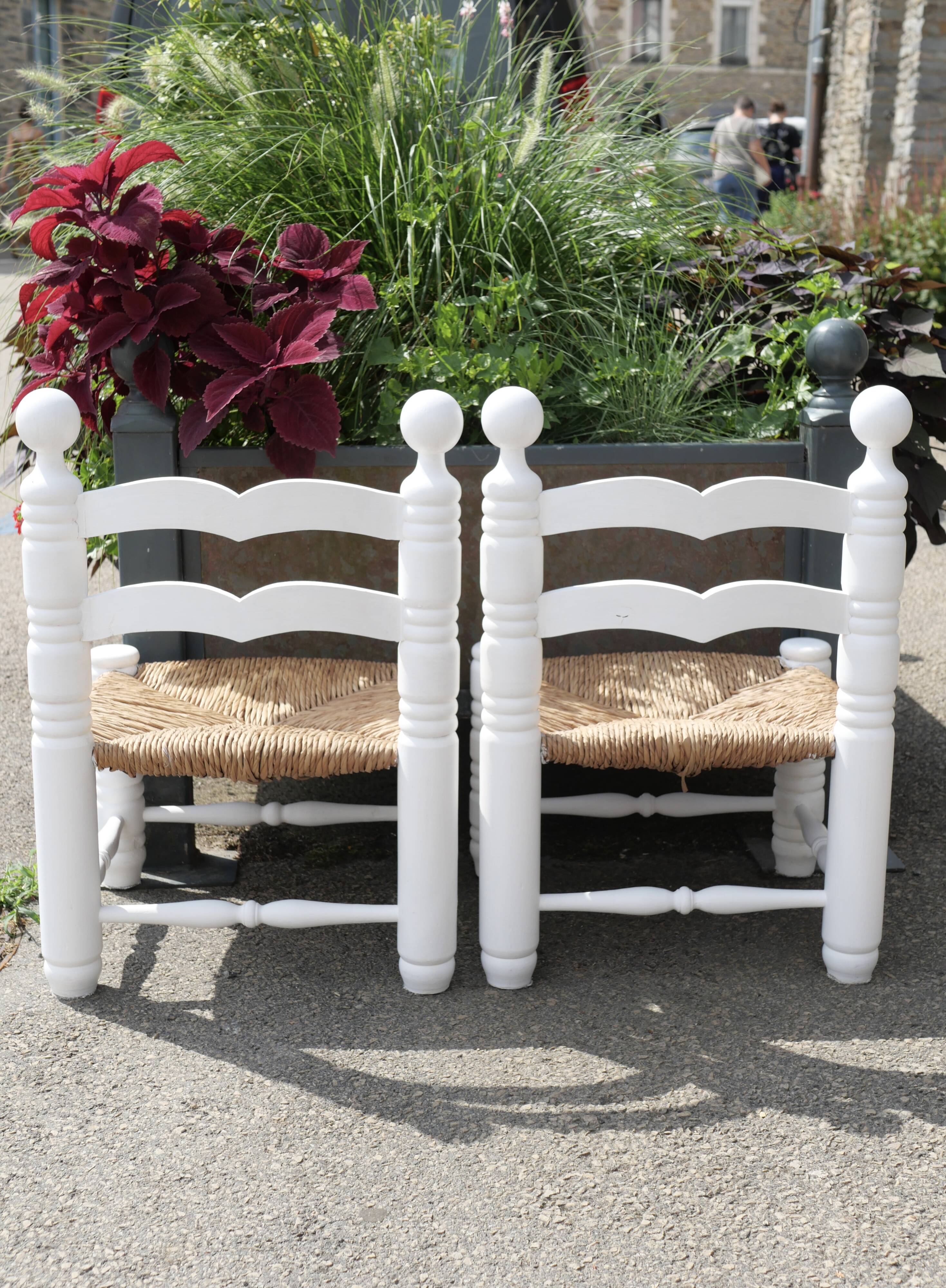 Pair of rush-seated chairs by Charles Dudouyt