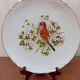 Two Limoges porcelain plates signed M. Hague.