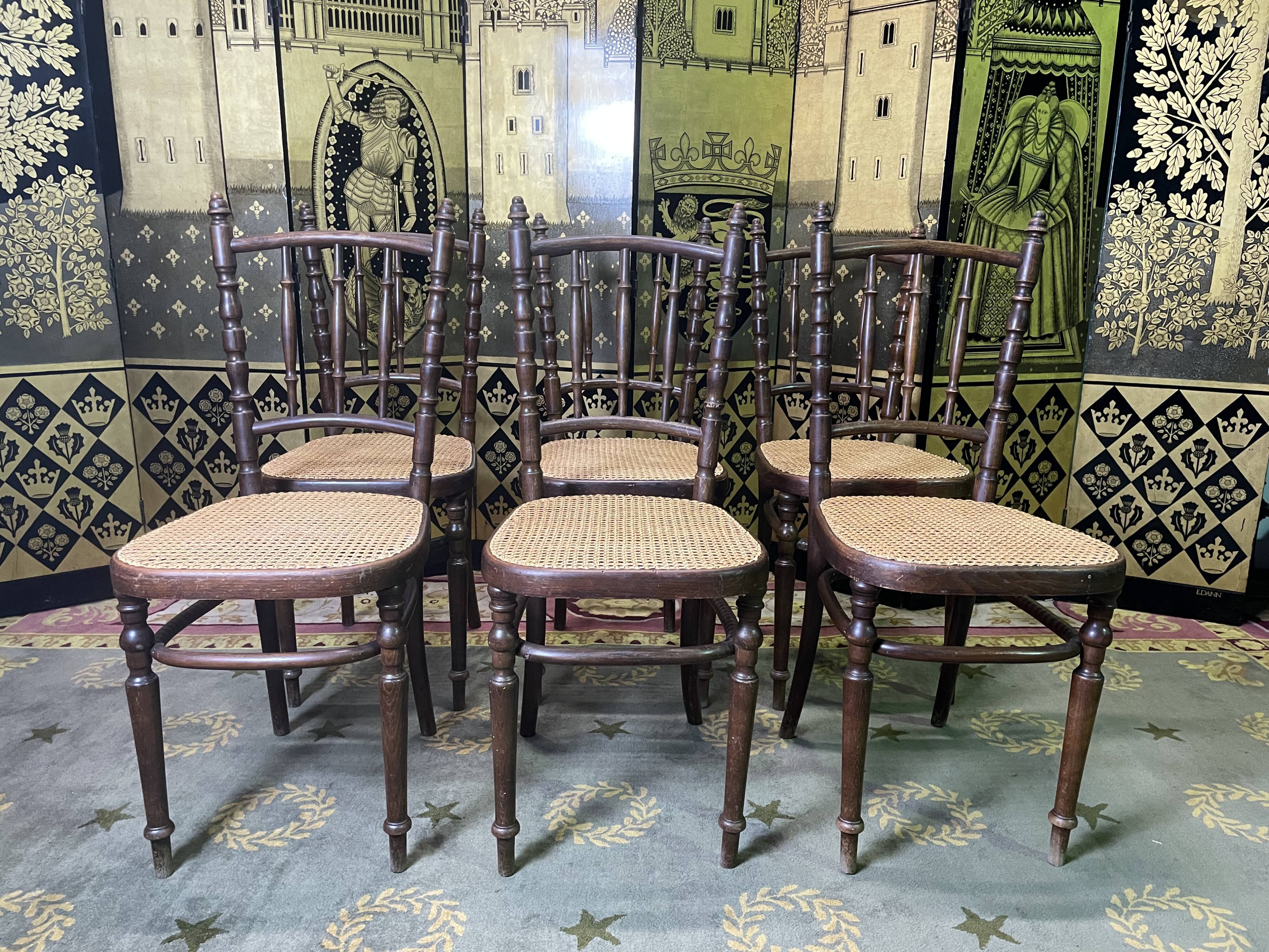 Suite de 6 chaises bistrot en cannage Fischel
