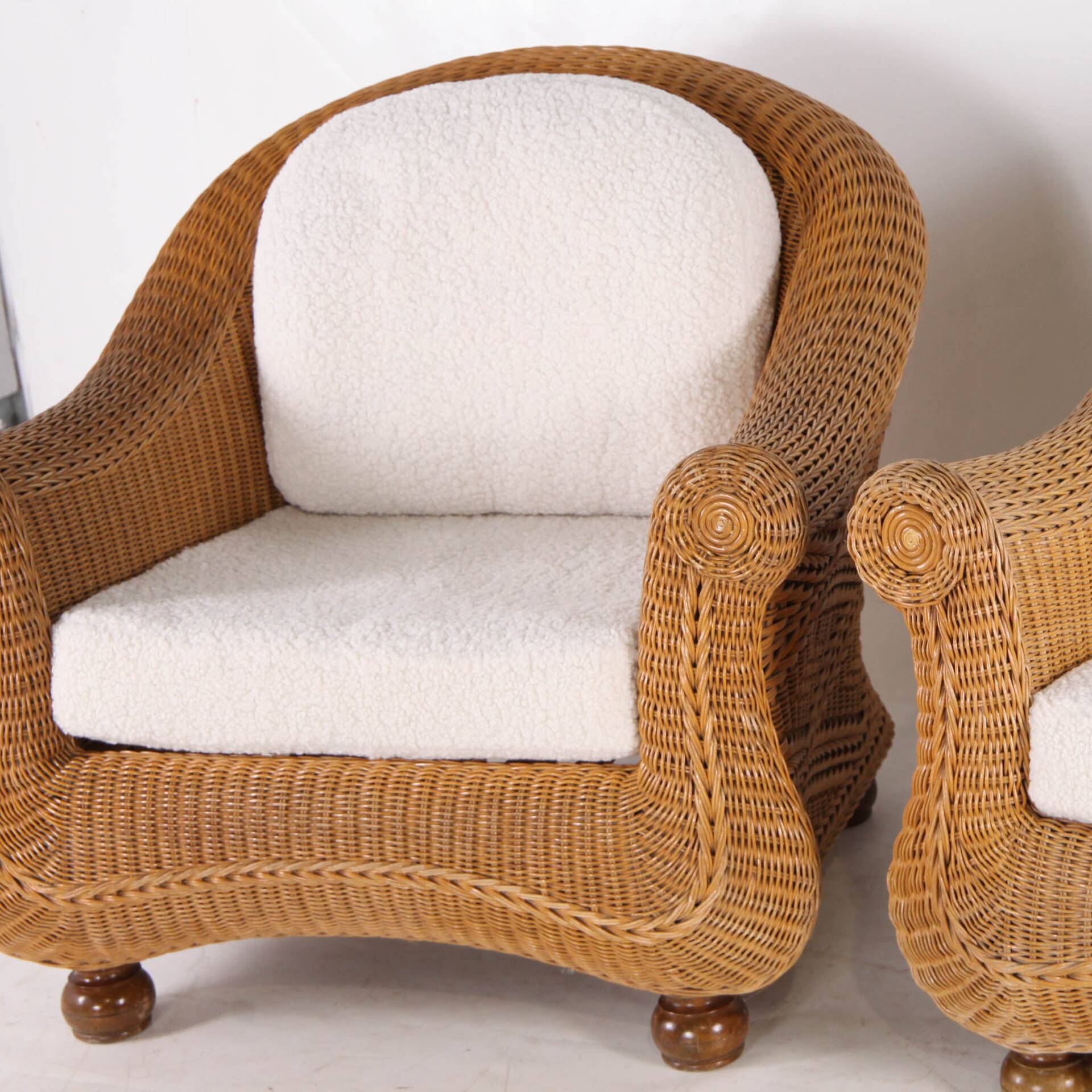Pair of woven wicker armchairs