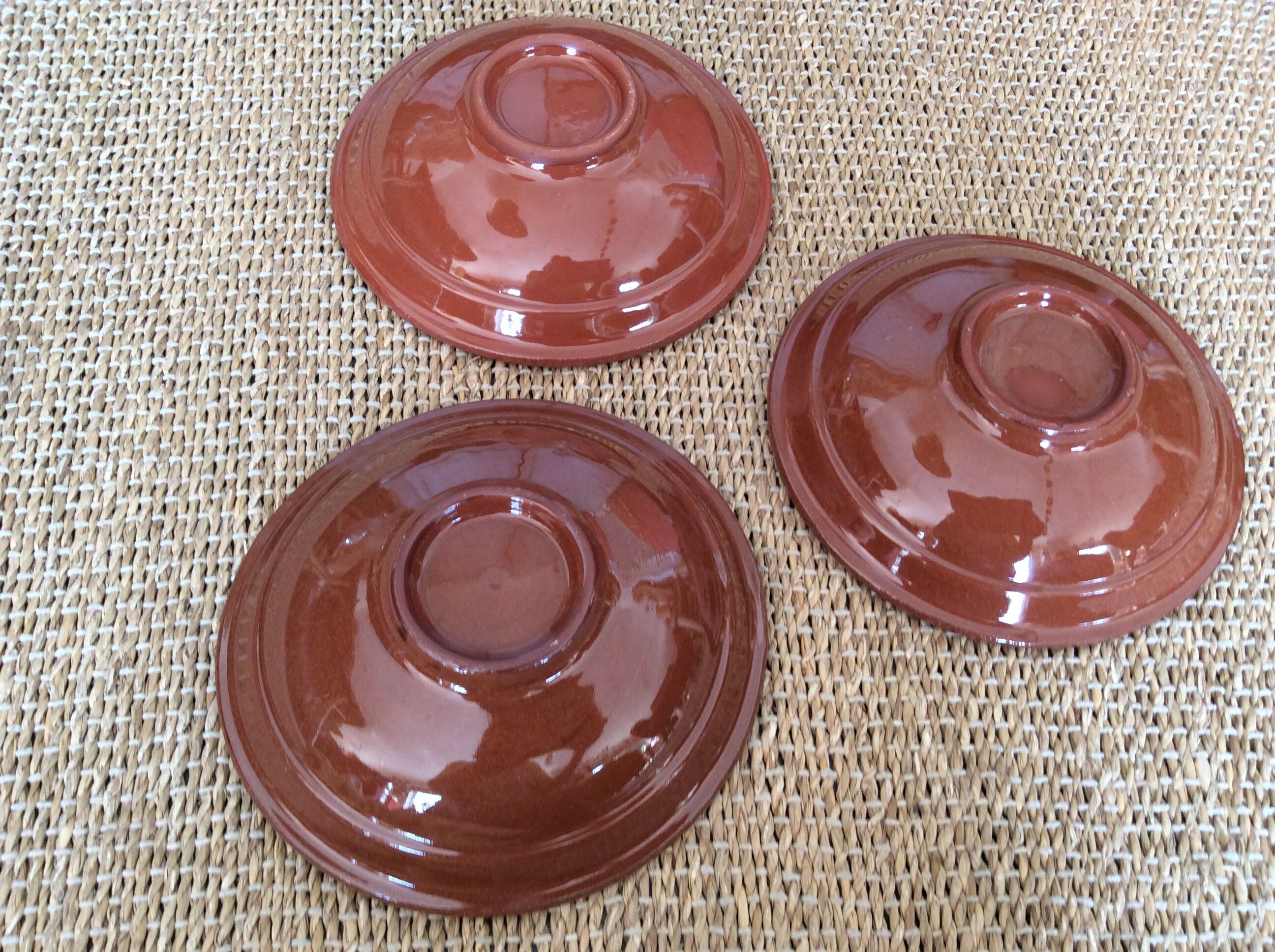 3 glazed terracotta plates