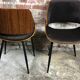 Scandinavian style chairs in curved plywood covered with brown fabric