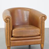 Sheep leather club chair in neutral cognac colour and in good condition