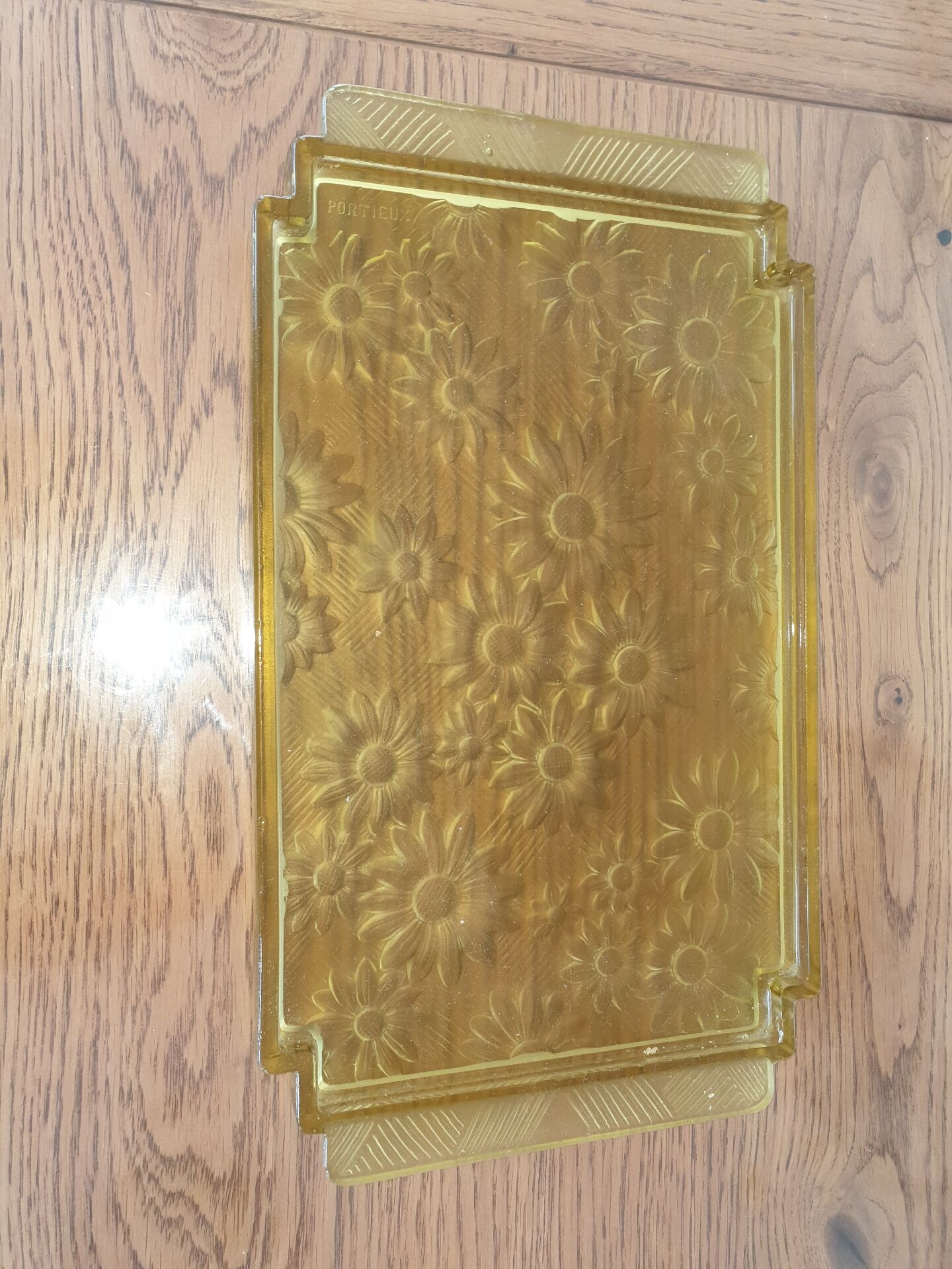 Pressed glass yellow bowl with floral pattern by Portieux.