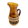 Amber glass and wicker carafe