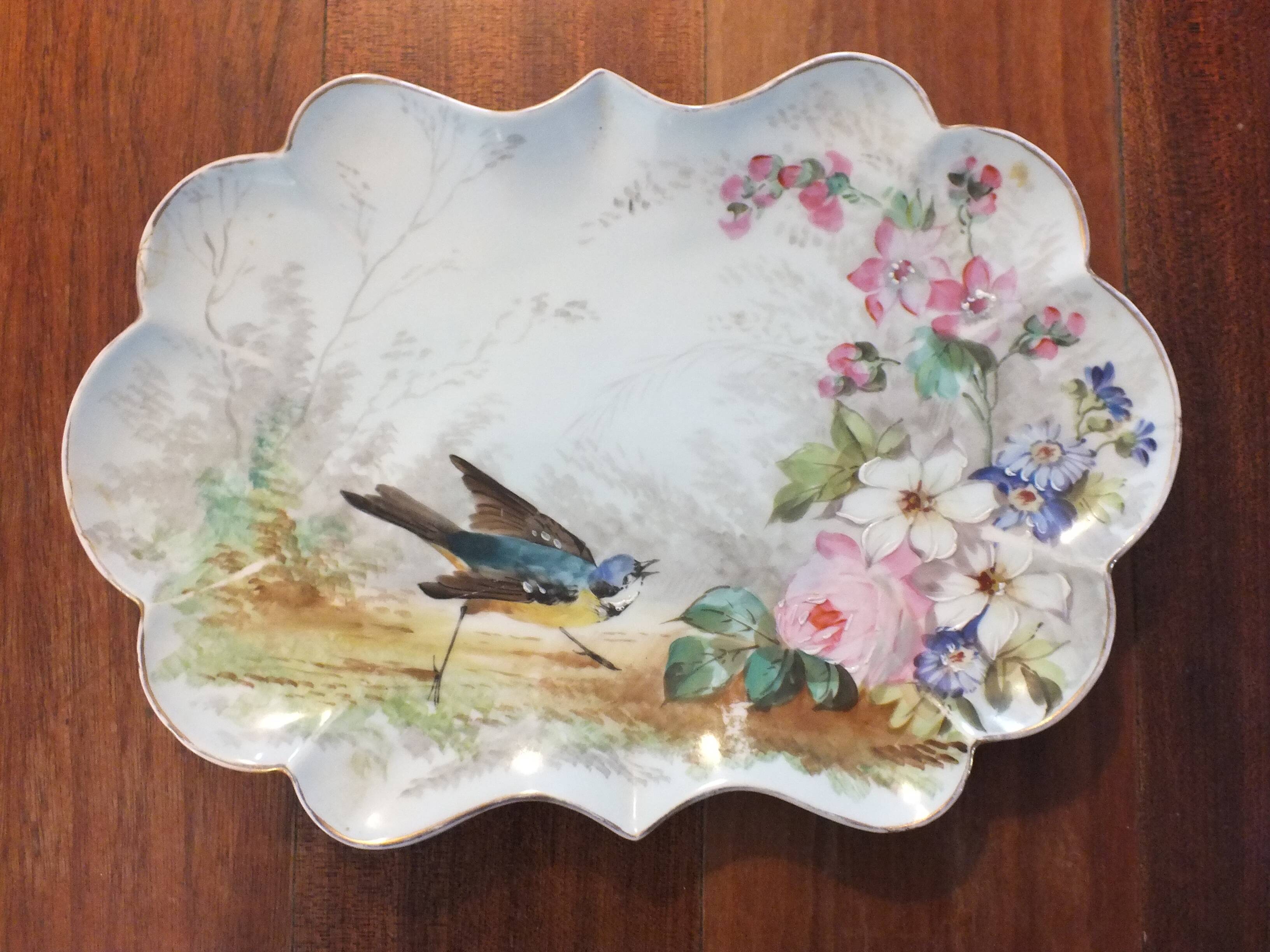 Pair of small porcelain dishes painted with birds and flowers 19th