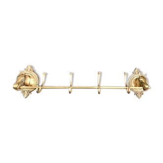 Former coat rack with horse-headed medallion 4 brass hooks