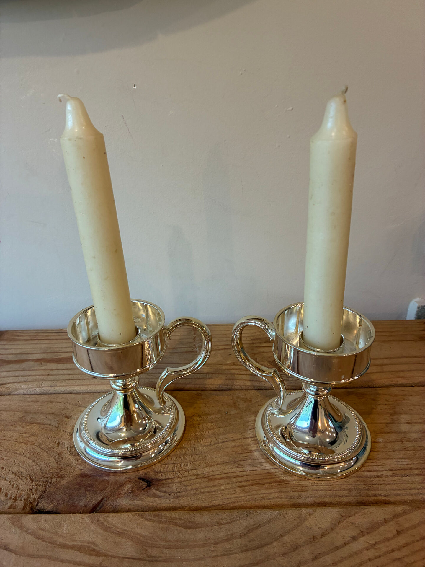 Pair of vintage silver-plated candlesticks with handles