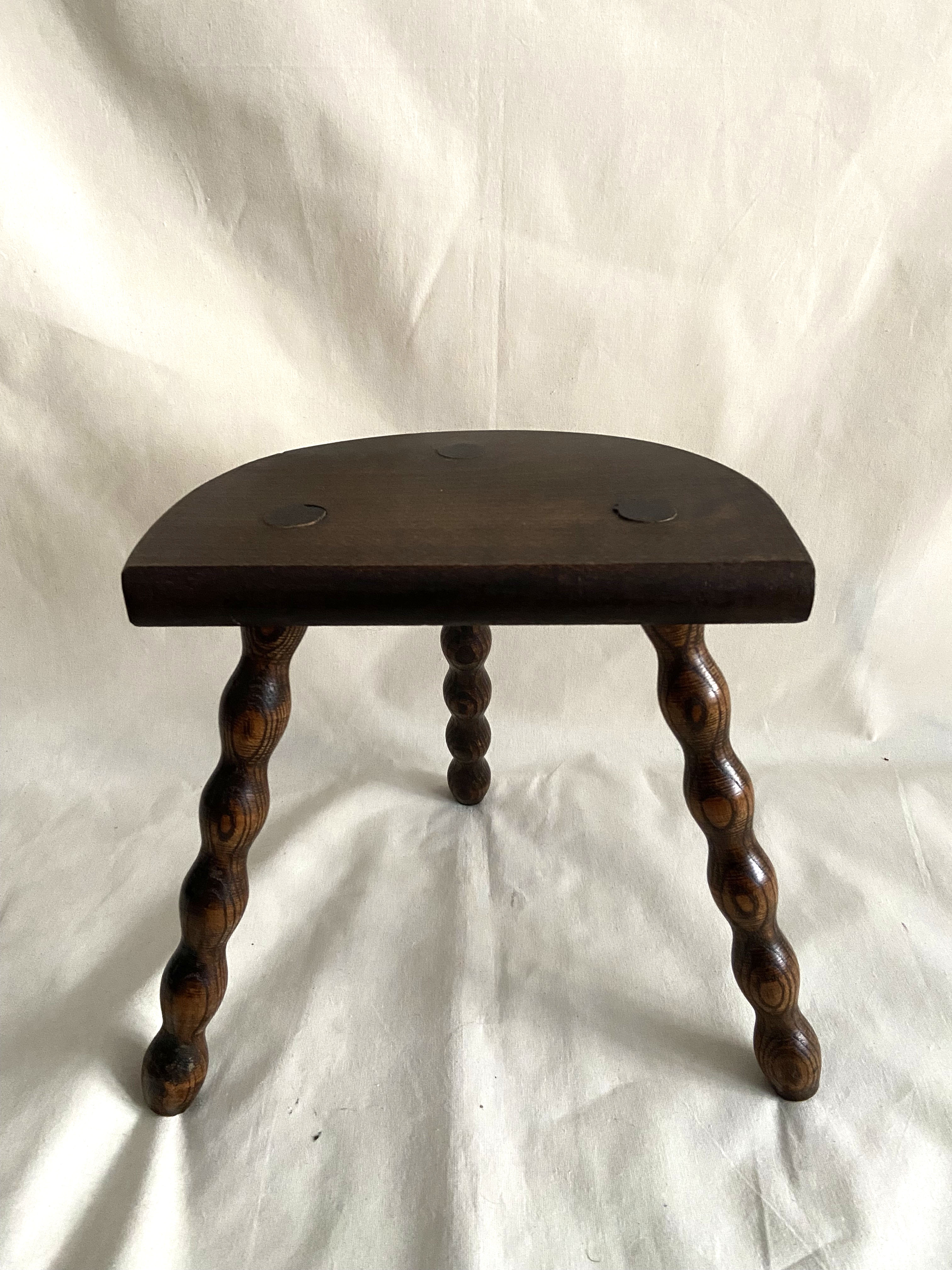 Tripod stool in turned wood