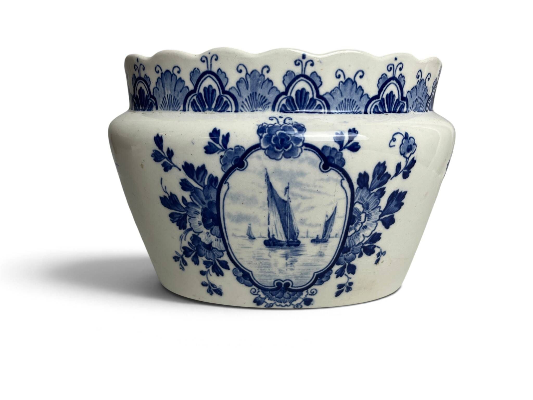 Delft, decorative pot planter with boat and windmill design from the early 20th century.