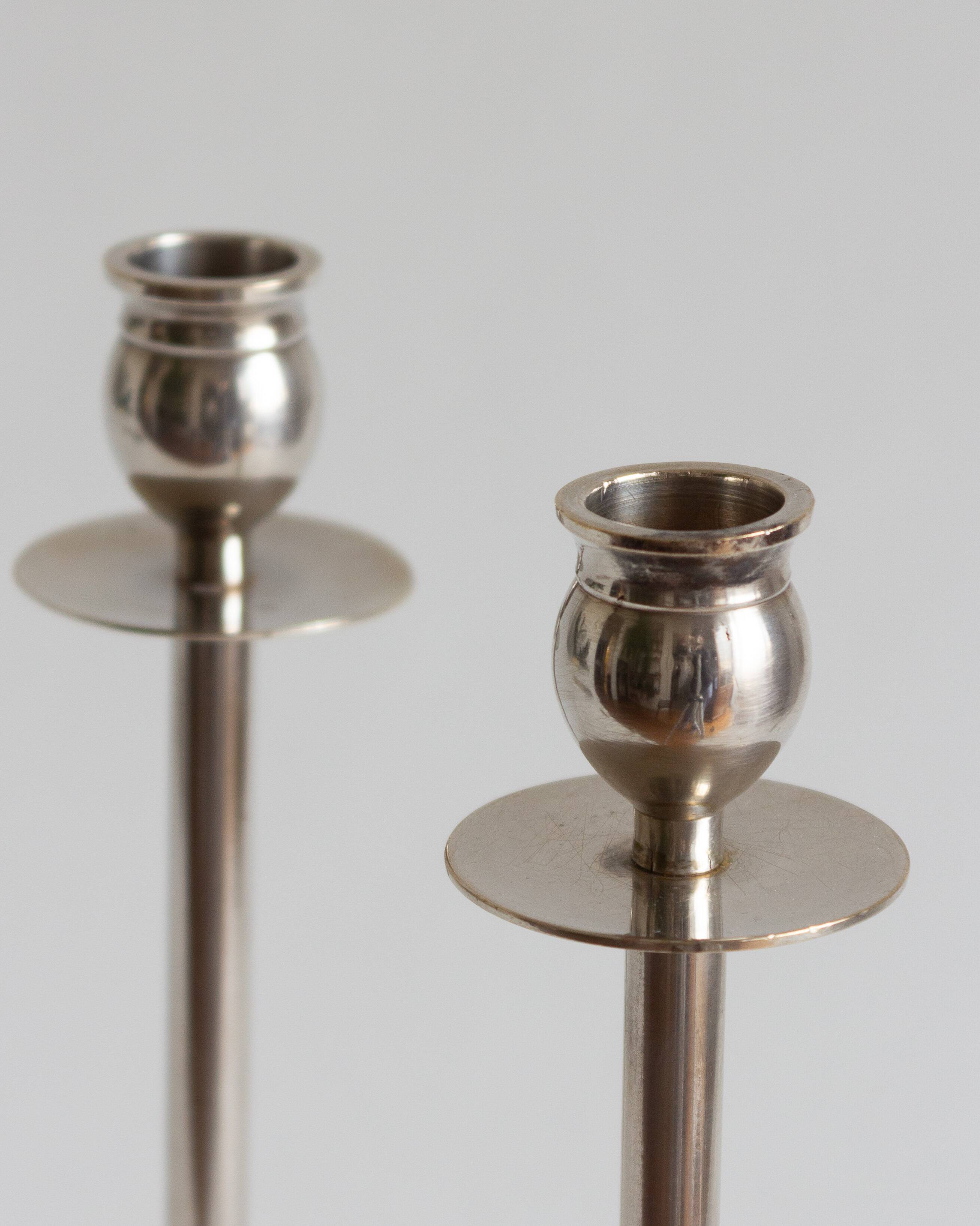 Duo of silver-plated brass candlesticks, 1950s/1960s