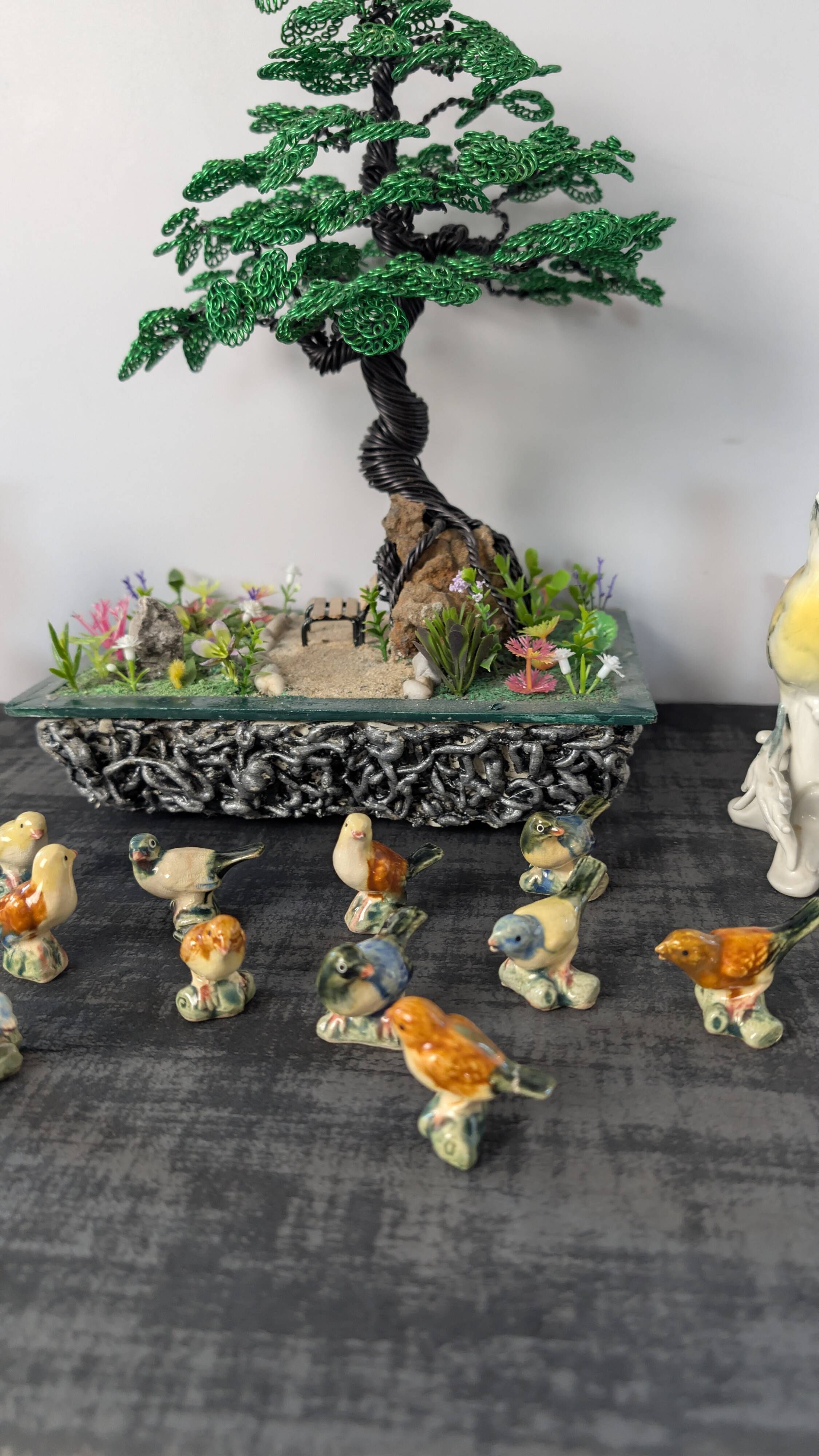 Set of 11 miniature birds in polychrome glazed ceramic.