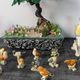 Set of 11 miniature birds in polychrome glazed ceramic.