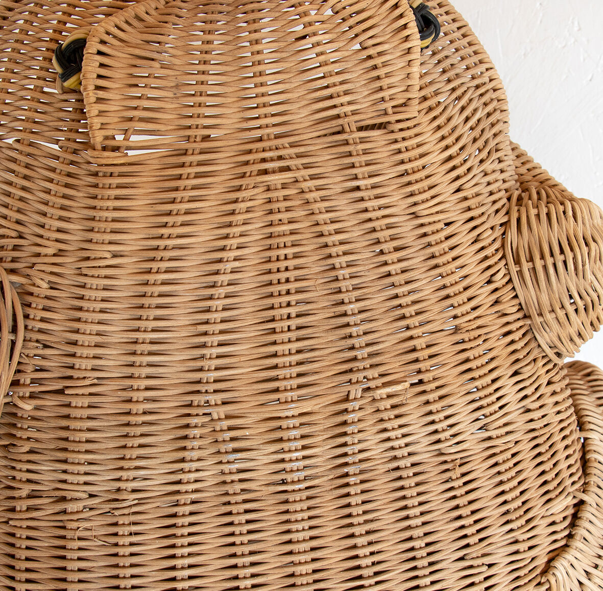 Wicker and braided rattan magazine door by Olivier Cajan