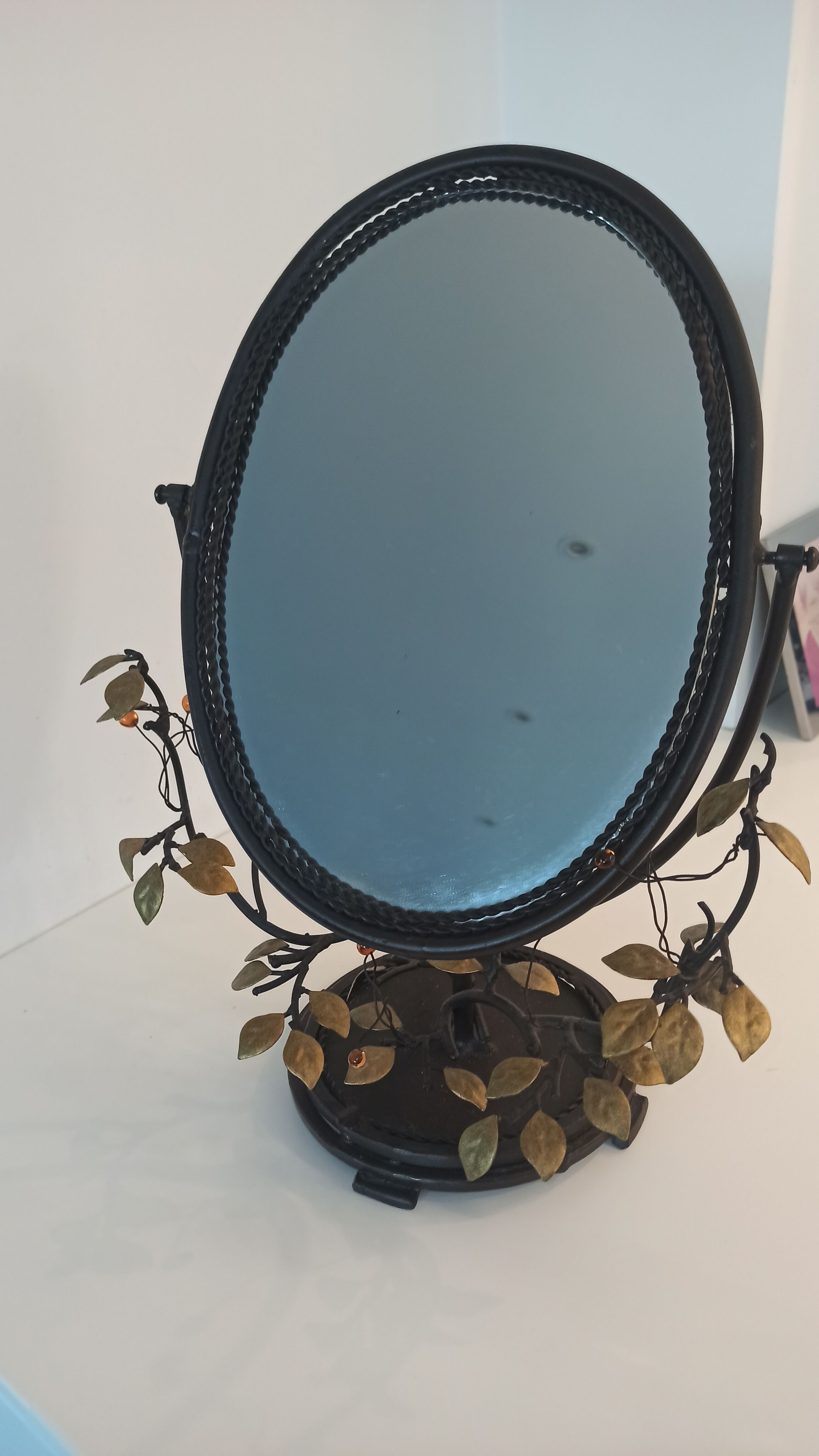 Table mirror, tilting psyche in patinated bronze decorated with leaves and fruits