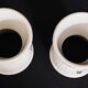 Pair of porcelain diabolo egg cups decorated with 20th century barbels