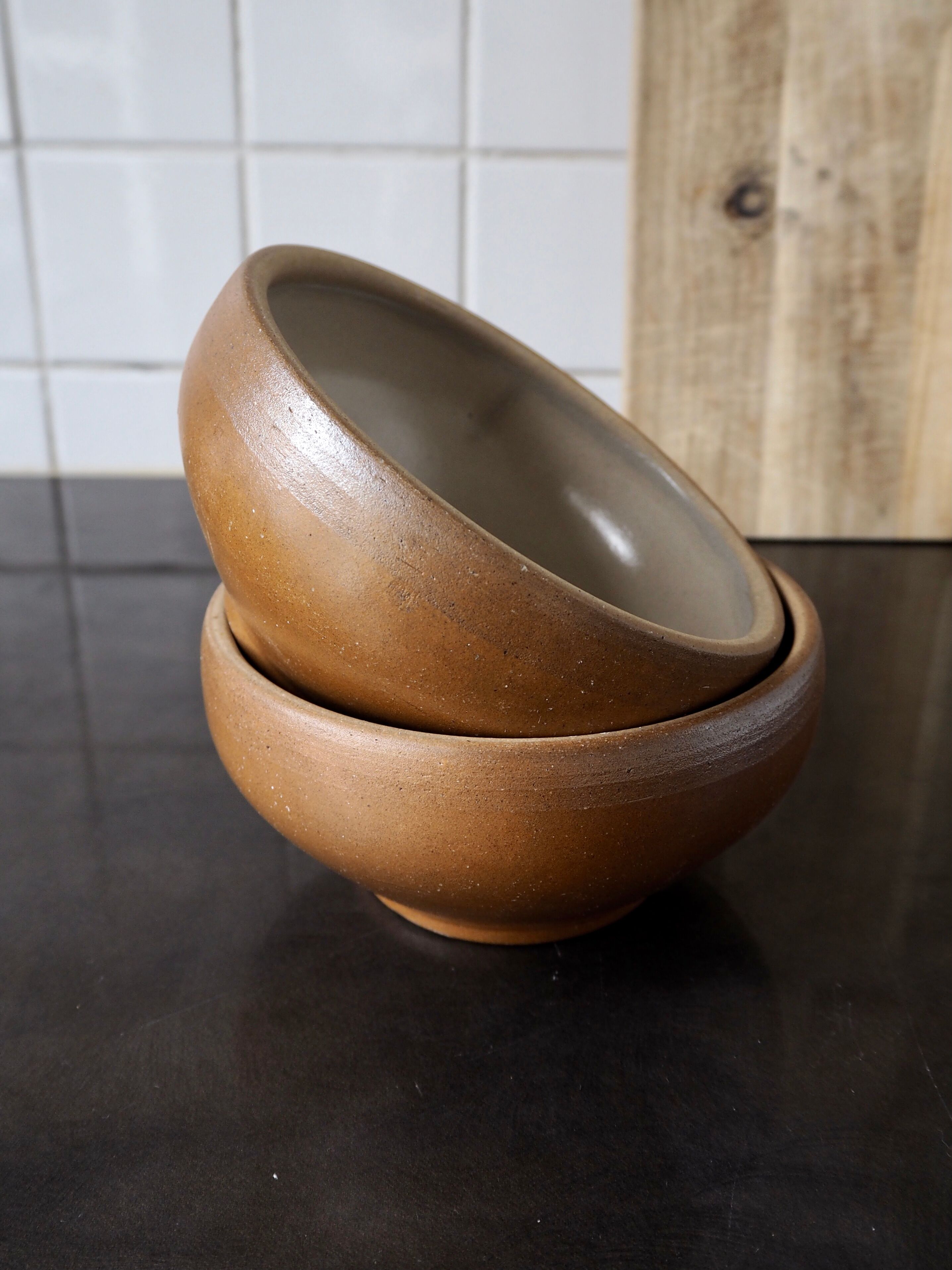 Pair of matte sandstone bowls