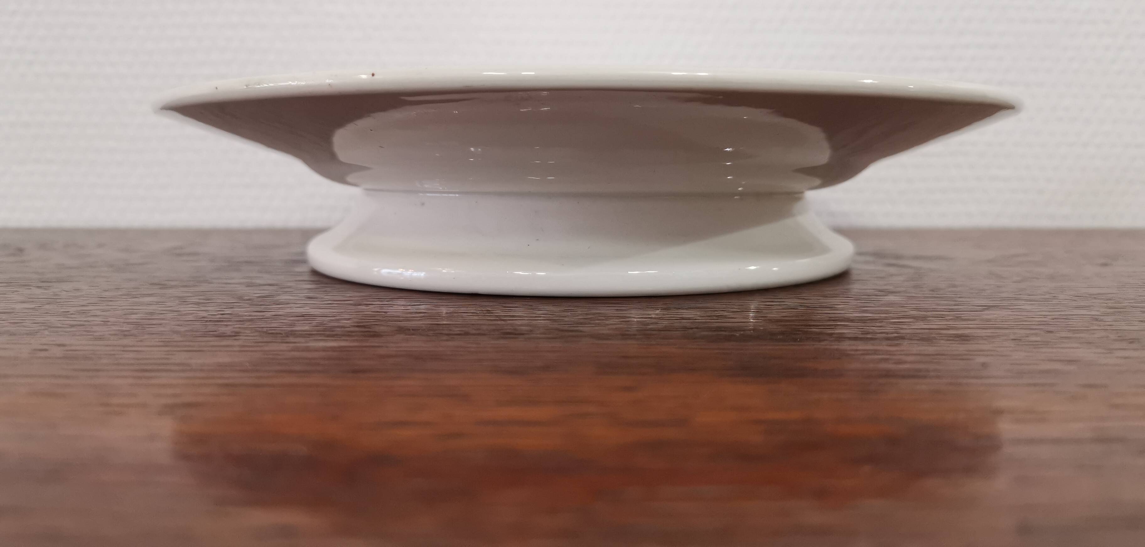 Old round dish on shower stand in art deco earthenware from the 1930s