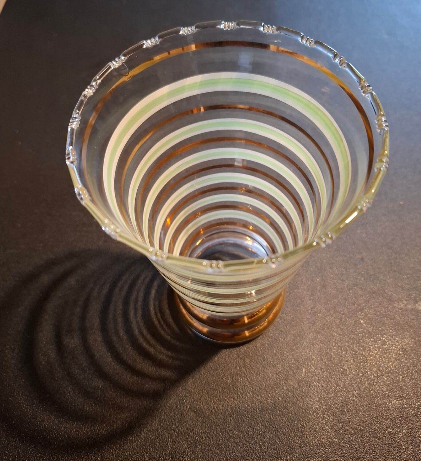 Vintage vase with green and gold trim.