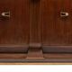 Art Deco walnut sideboard with brass details and sculptural base, France, 1930s