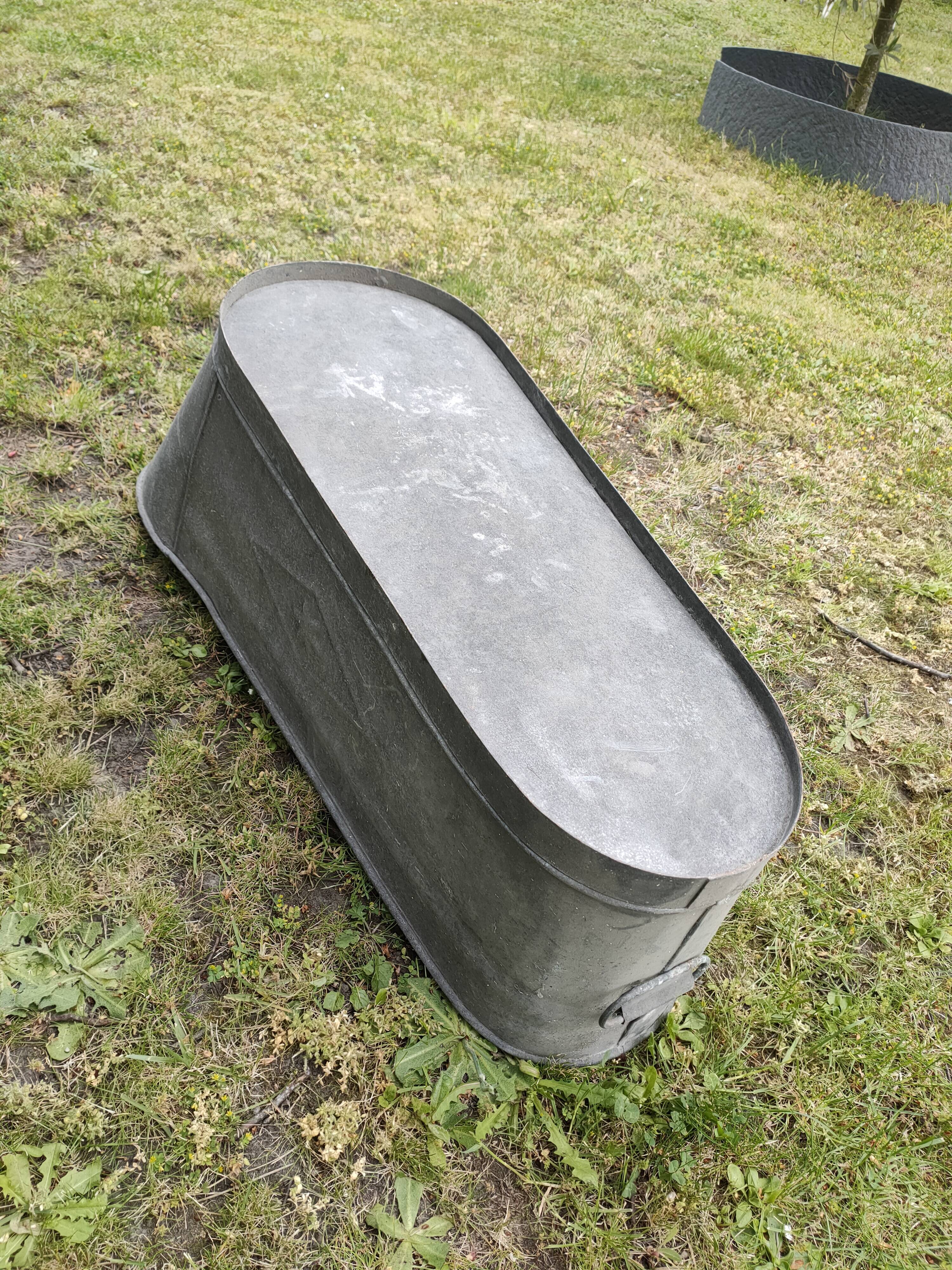 Antique children's bathtub in zinc