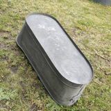 Antique children's bathtub in zinc