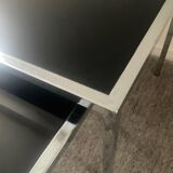 Pair of nesting tables in chromed metal and glass