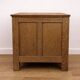 Oak side cabinet with carved motifs