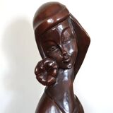 Wooden sculpture of a woman with a flower, 1970s