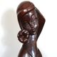 Wooden sculpture of a woman with a flower, 1970s