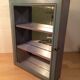 Display shelf with miniature blue wood and mirrors
