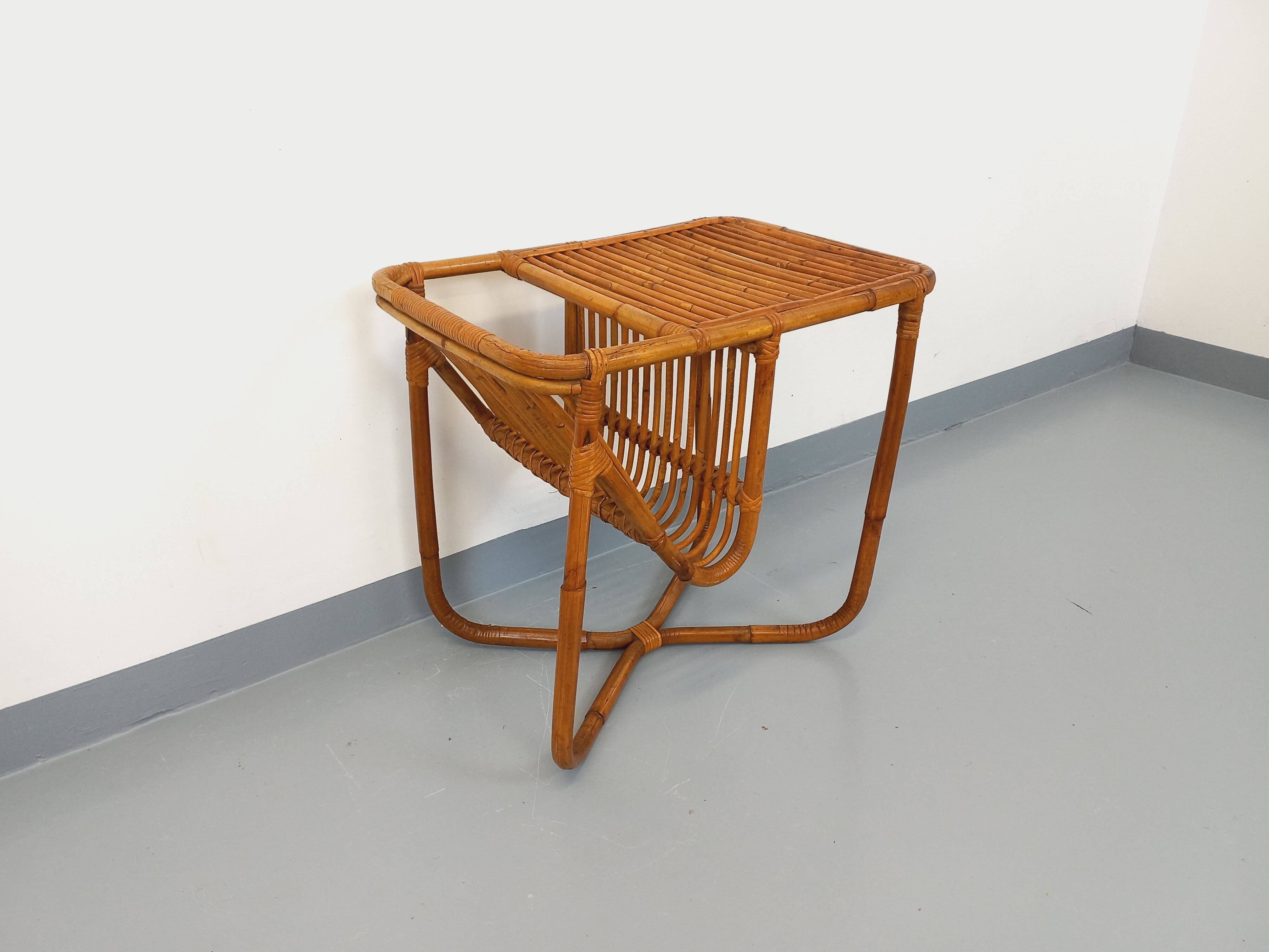 Side table / coffee table with vintage 1960s rattan magazine rack.