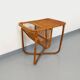 Side table / coffee table with vintage 1960s rattan magazine rack.
