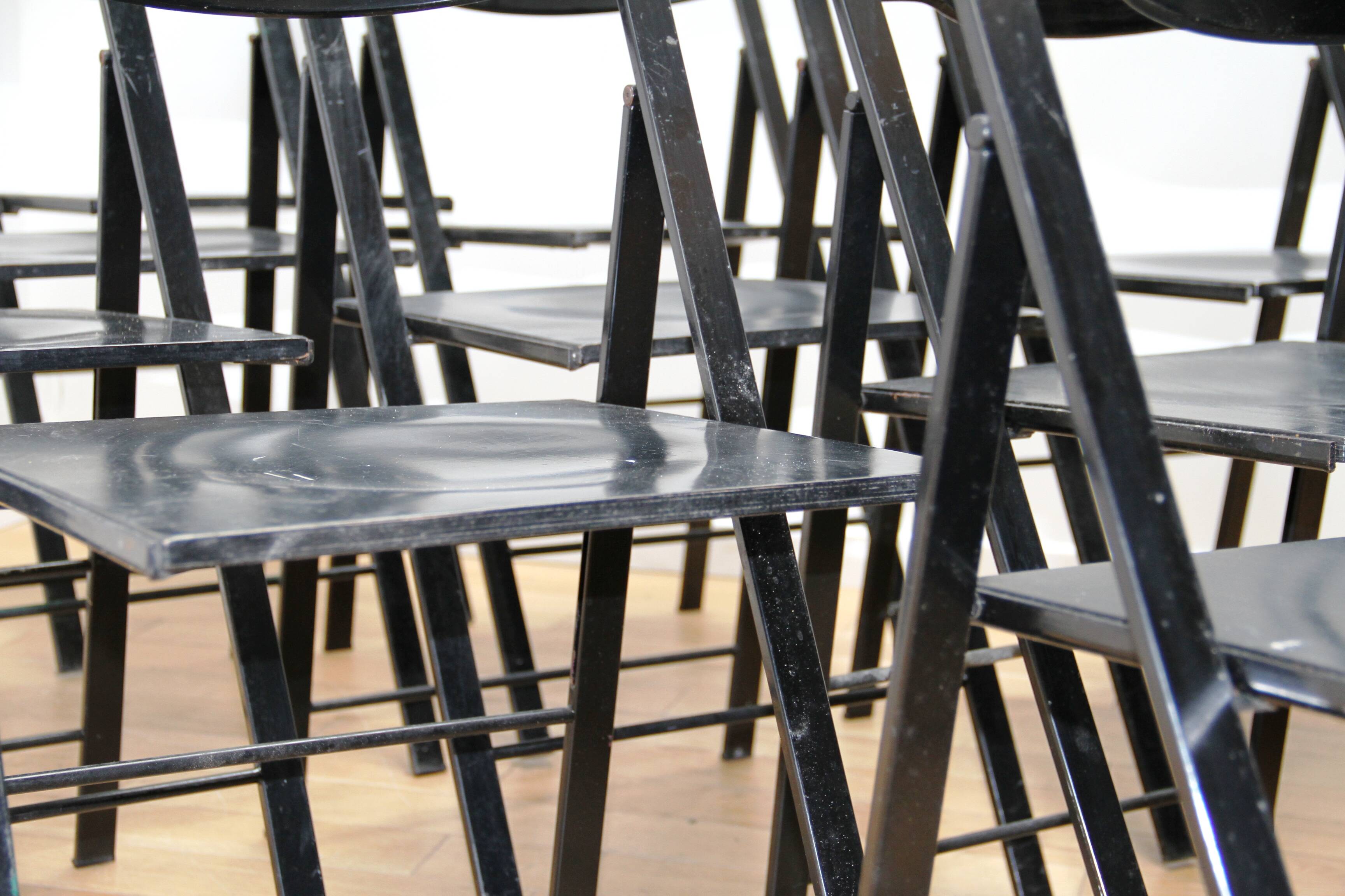 Suite of 12 folding designer chairs