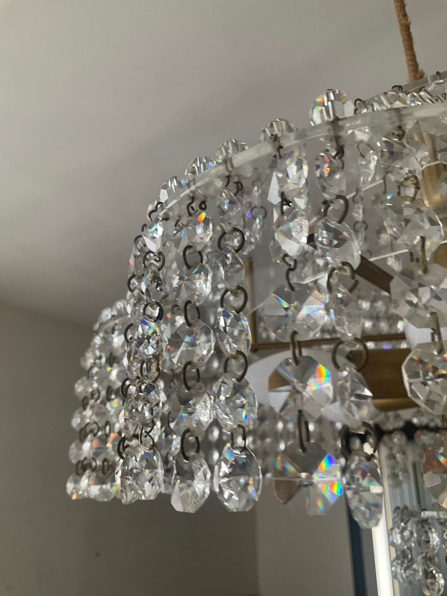 Vintage lucite chandelier with a cascade of crystal pendants from the 1970s.