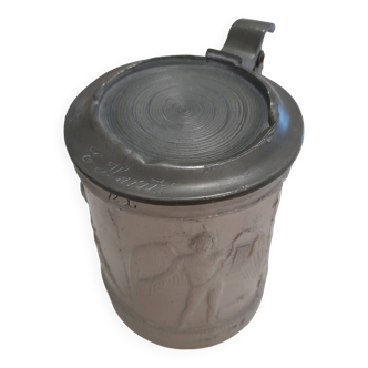 Stoneware tankard with pewter lid