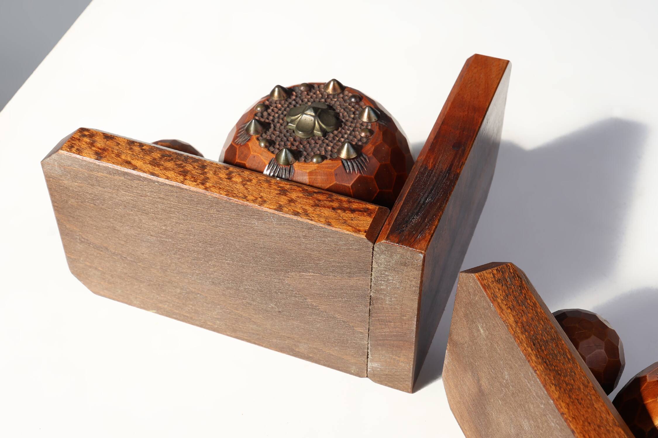 Pair of Art Deco faceted ball bookends in oak with metal decorations