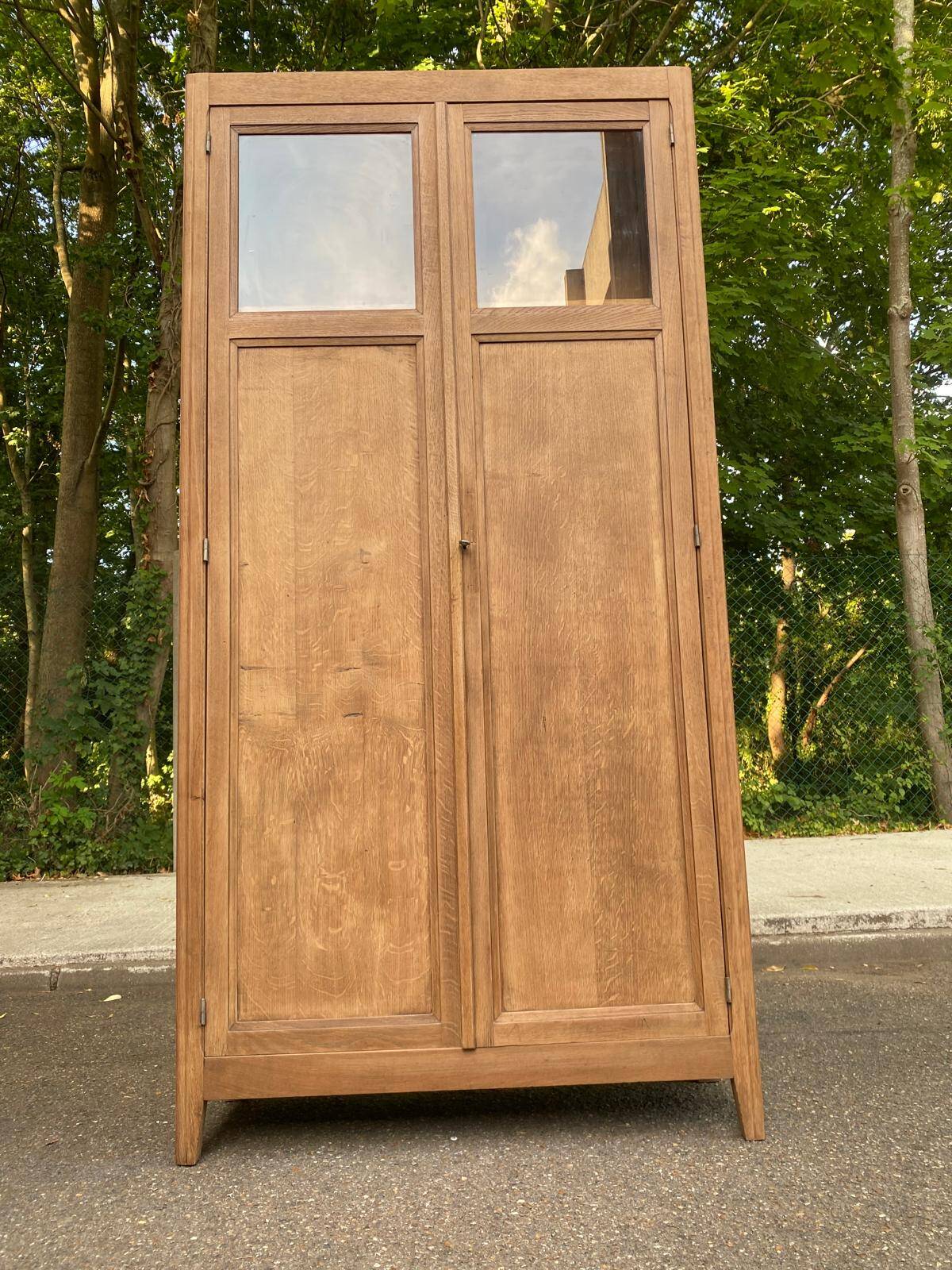 Parisian bonnetière cabinet, stripped display in solid oak from the 1930s.