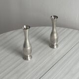 2 shiny metal vases