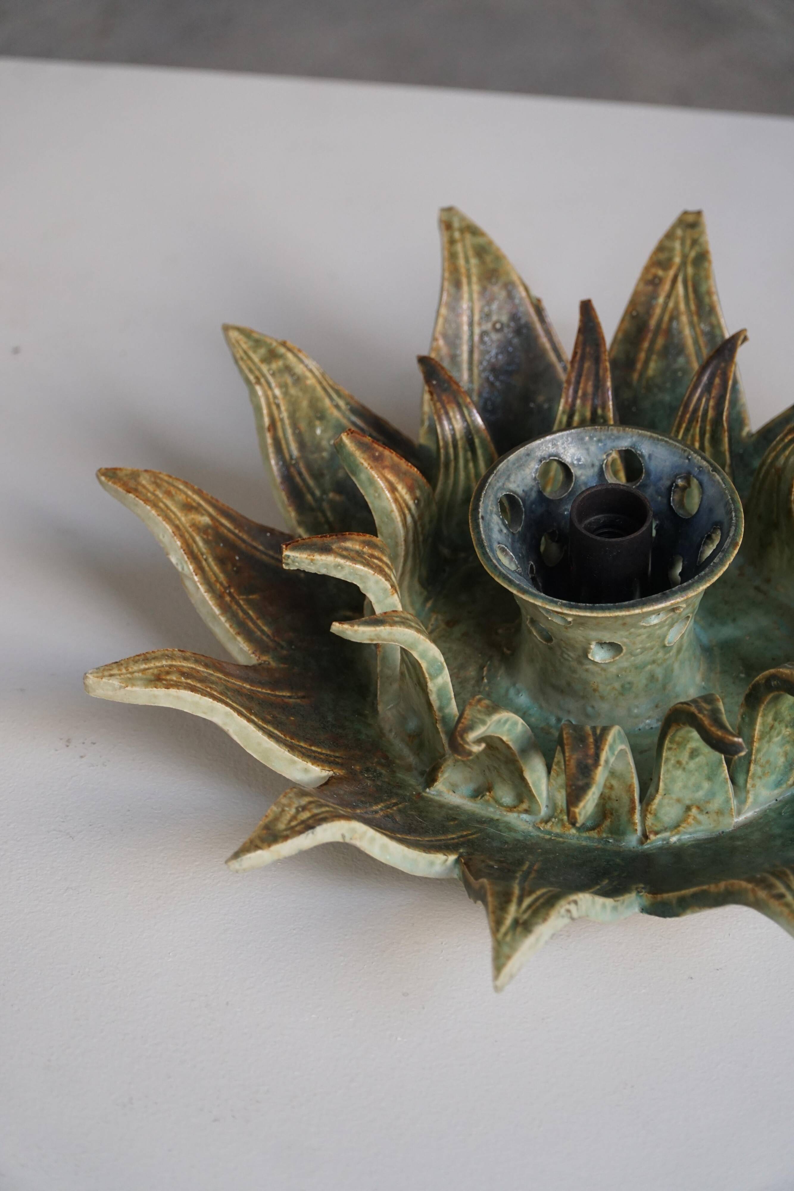 Mid-20th century ceramic sun wall lamp or decorative wall sculpture, 1960s.