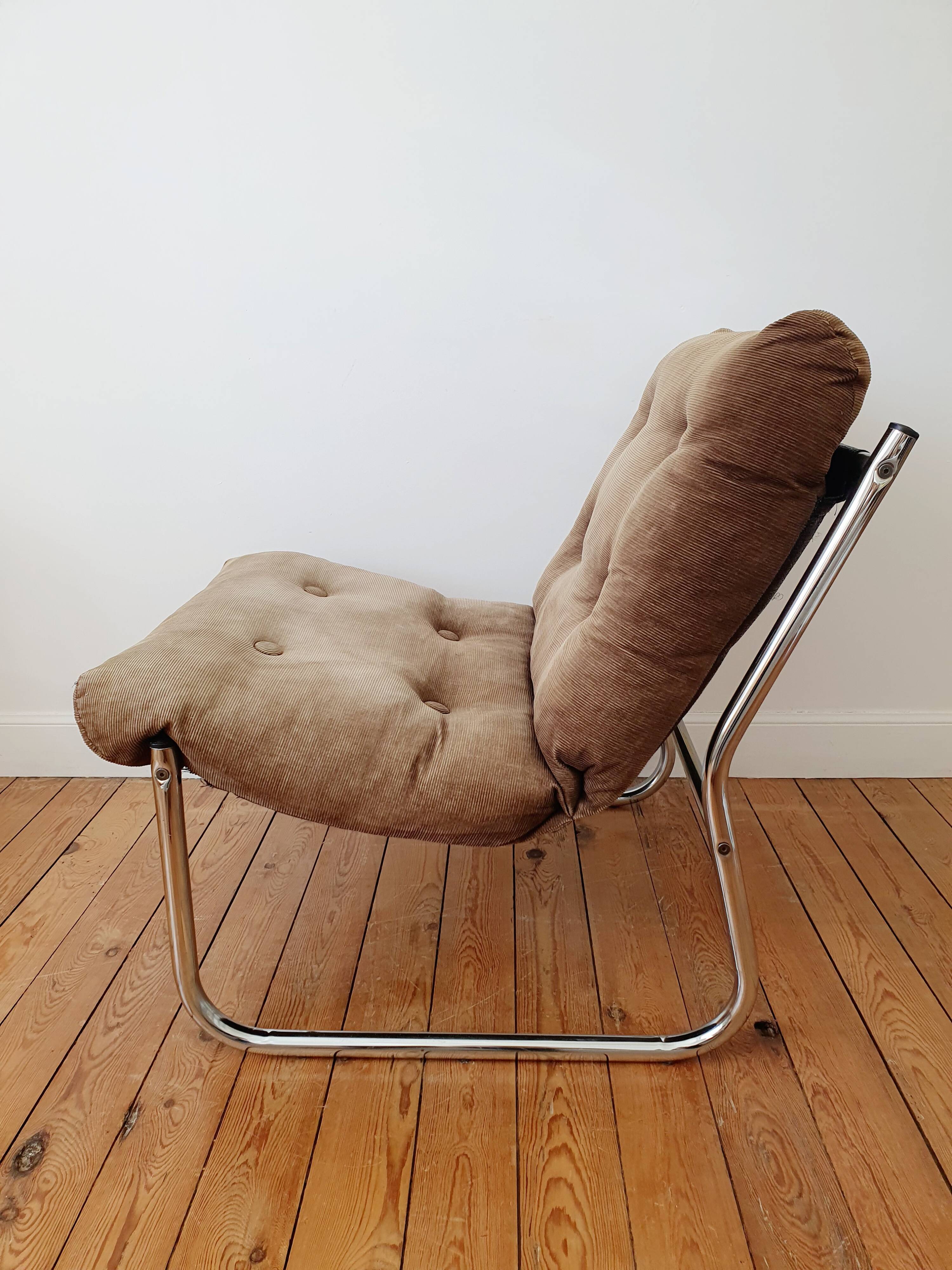 Vintage tubular chrome and velvet armchair