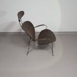 Armchair designed by Yuzuru Yamakawa  Metal frame.  Seat and back in braided rattan.