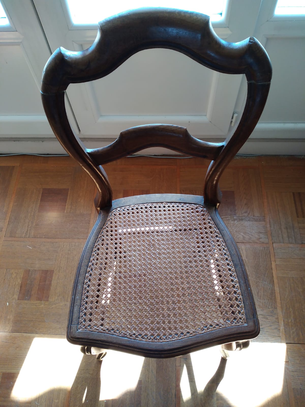 6 mulched solid wood chairs and 2 canework chairs