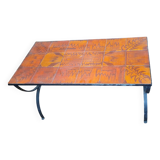 Wrought iron and orange ceramic coffee table