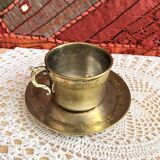 Silver metal cup and saucer