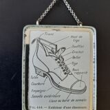 Old illustration "Exterior of a shoe" inserted under mirror