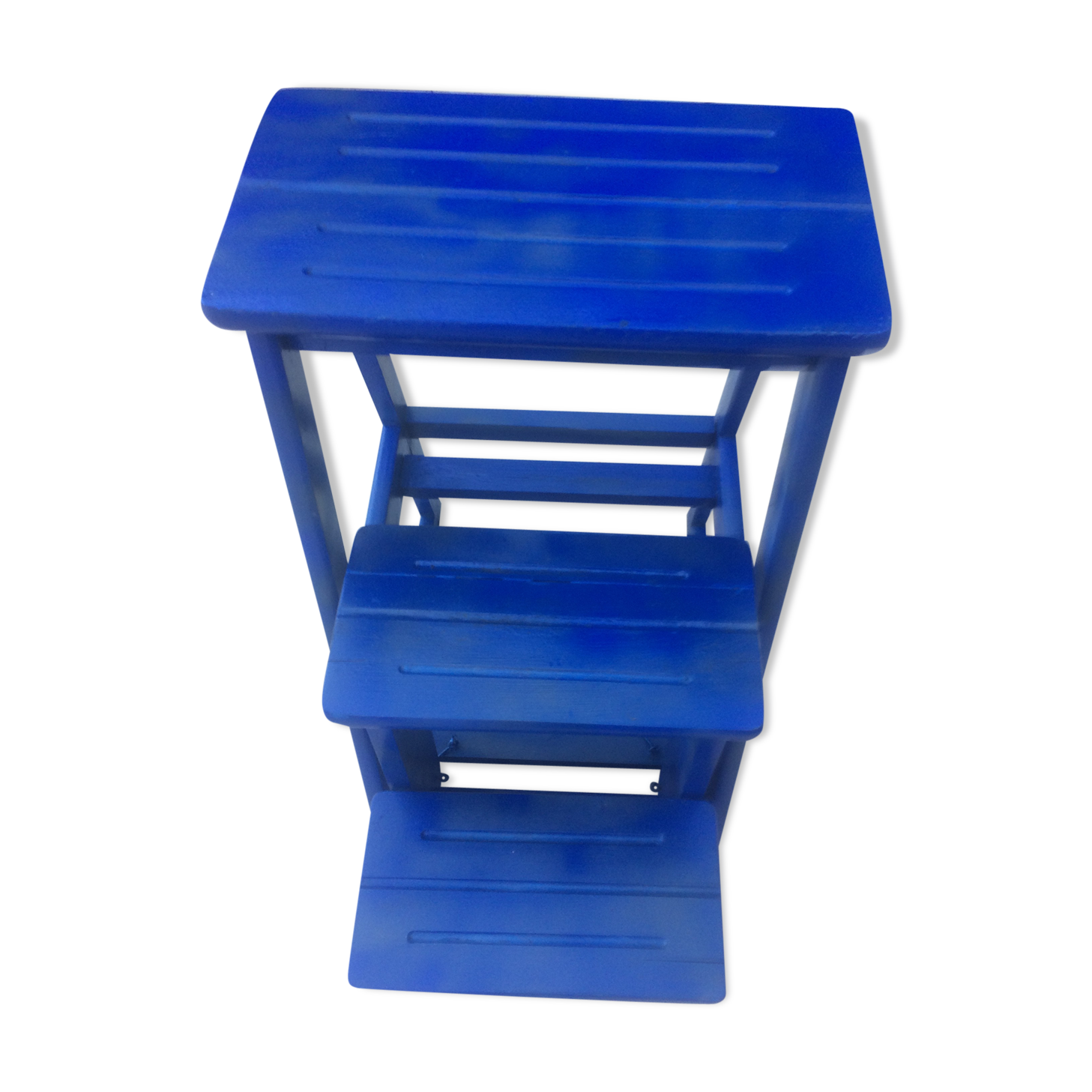 Foldable stepladder in small shelf