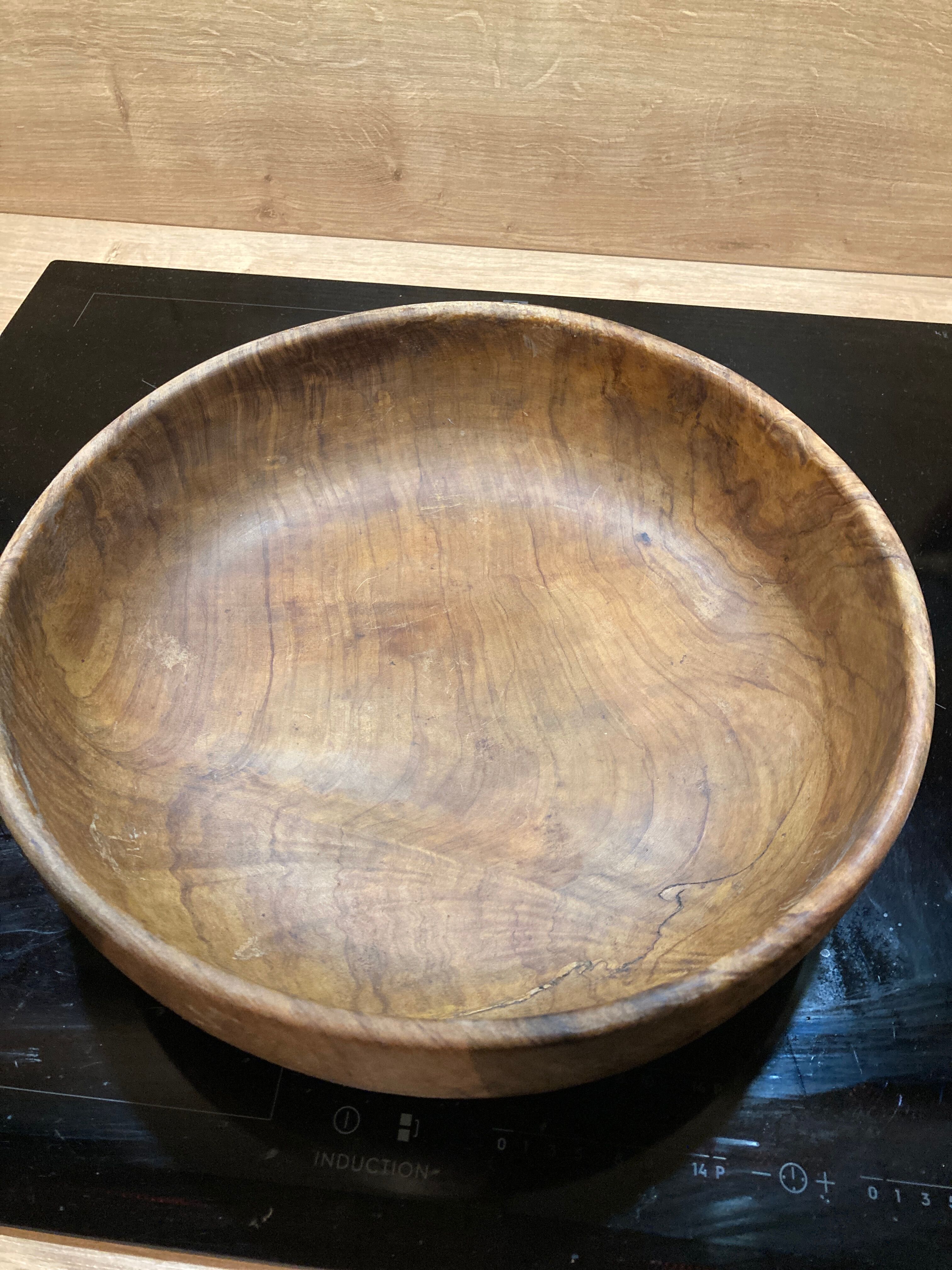Round dish in olive tree